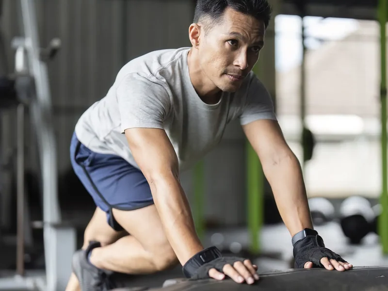 Physical therapist assessing a patient's injured area movement and mobility