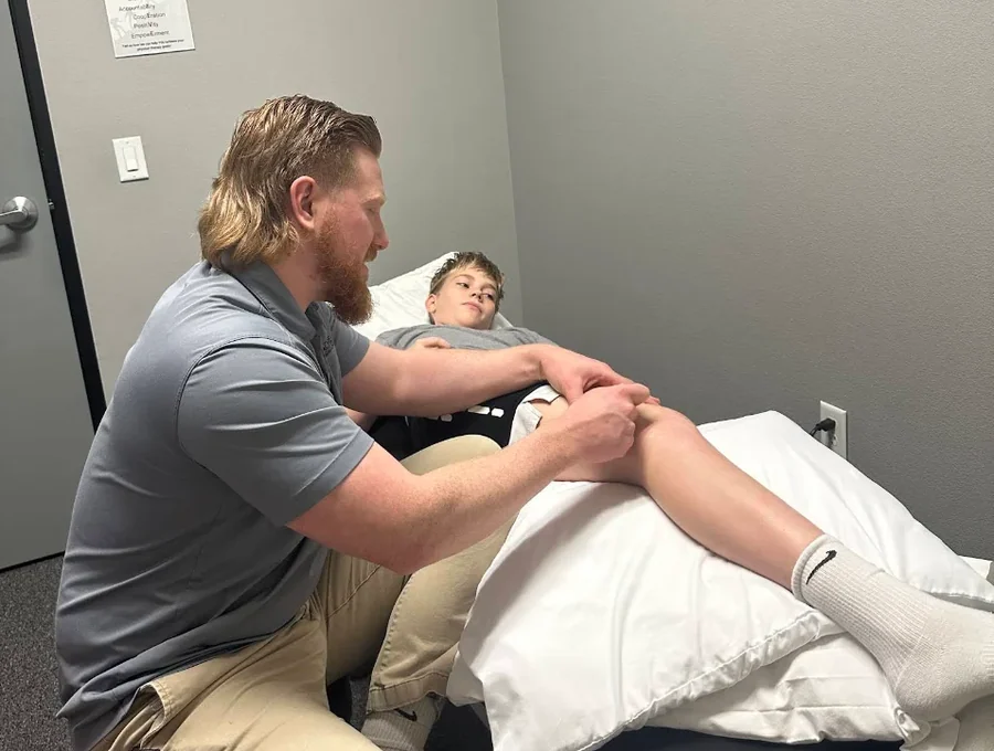 Physical therapist guiding a patient through a one-on-one session