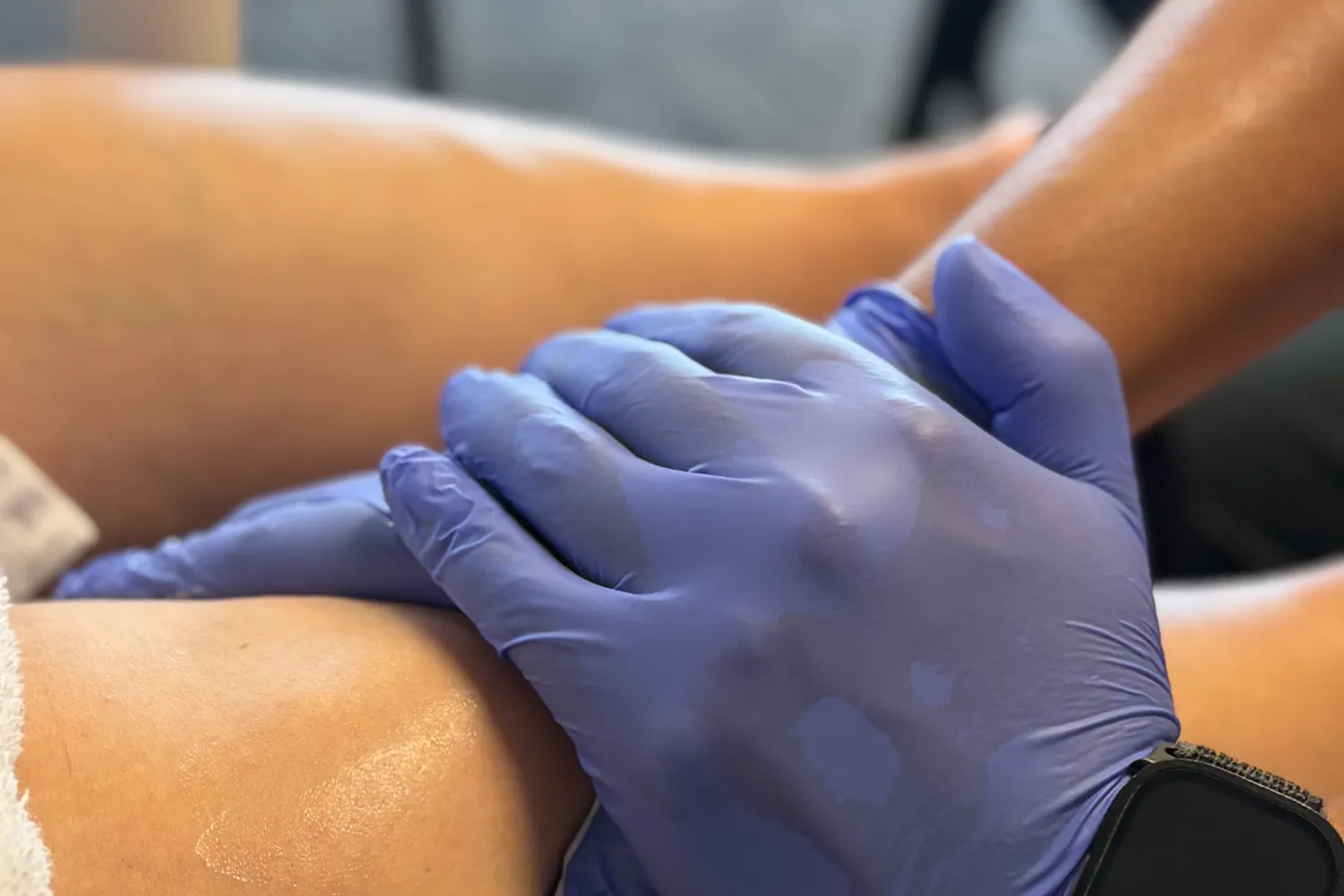 Therapist performing hands-on manual therapy on a patient
