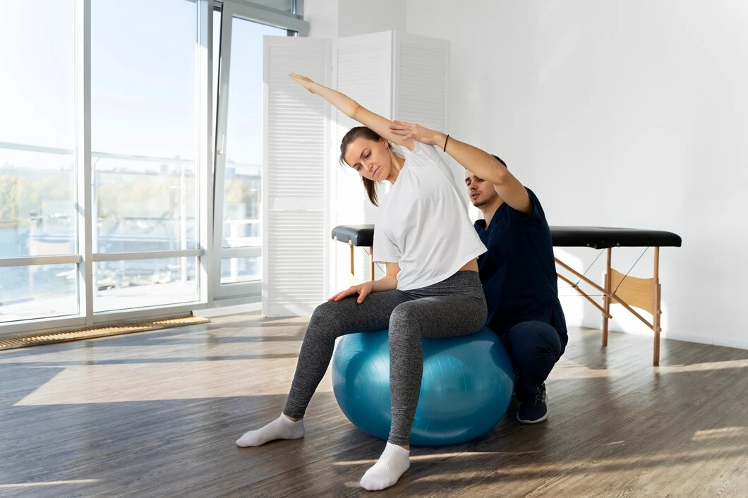 Physical therapist performing therapeutic exercise with a patient