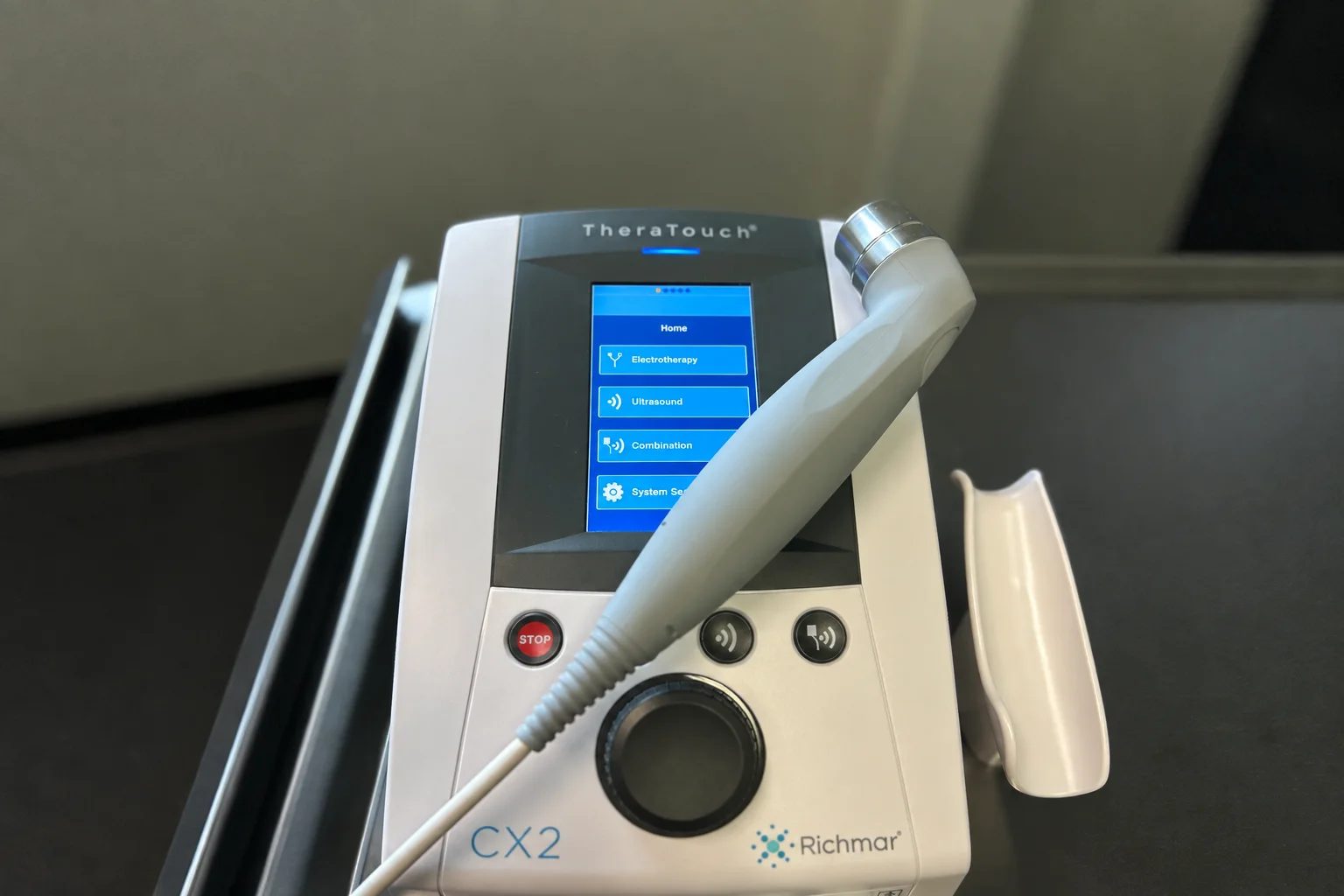 Physical therapist performing ultrasound with a patient